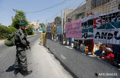An Israeli border policeman stand guard during a demonstration organised by young Palestinians in Hebron on September 3, 2017, against a recent decision by Israel to boost the powers of the settlers in the occupied West...