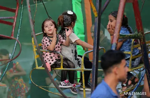 Palestinians celebrate on of Eid al-Adha or the feast of sacrifice, in Gaza city, on September 4, 2017. Muslims around the world are celebrating Eid al-Adha, the "Feast of Sacrifice", which marks the end of the annual pi...