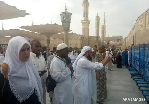Muslim pilgrims visit Al-Baqi, the main cemetery for people are buried since the era of the Prophet Mohammad's family, relatives and companions, behind the Al-Masjid al-Nabawi, (the Mosque of the Prophet), after their du...