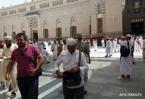 Muslims pilgrims visit the tomb of Prophet Mohammad at Al-Masjid al-Nabawi (The Mosque of the Prophet) after their duty of pilgrimage in the holy city of Medina, Saudi Arabia Sept. 11, 2017. Photo by Mohammed Hassan