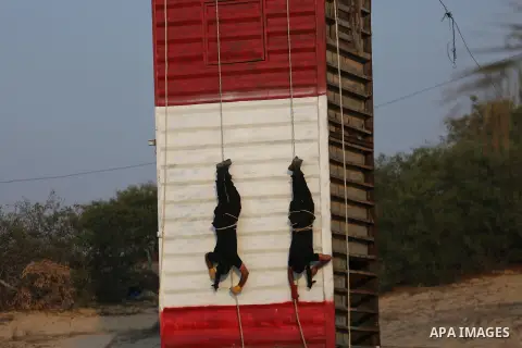 Palestinian militants of al-Nasser Salah al-Deen Brigades, the military wing of the Popular Resistance Committees, take part in a training exercise in Khan Younis in the southern Gaza Strip on September 19, 2017. Photo b...