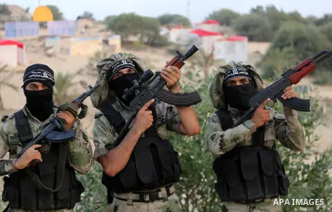 Palestinian militants of al-Nasser Salah al-Deen Brigades, the military wing of the Popular Resistance Committees, take part in a training exercise in Khan Younis in the southern Gaza Strip on September 19, 2017. Photo b...