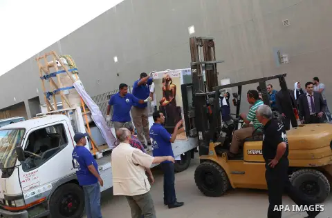 Egyptian workers transport statues upon its arrival at the restoration laboratory of the Grand Egyptian Museum (GEM) in Cairo, Egypt, on Sept. 20, 2017. A batch of statues were transported from the Egyptian Museum to the...