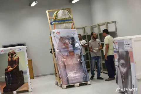 Egyptian workers transport statues upon its arrival at the restoration laboratory of the Grand Egyptian Museum (GEM) in Cairo, Egypt, on Sept. 20, 2017. A batch of statues were transported from the Egyptian Museum to the...