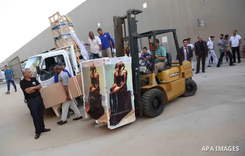 Egyptian workers transport statues upon its arrival at the restoration laboratory of the Grand Egyptian Museum (GEM) in Cairo, Egypt, on Sept. 20, 2017. A batch of statues were transported from the Egyptian Museum to the...