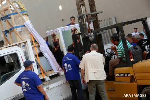 Egyptian workers transport statues upon its arrival at the restoration laboratory of the Grand Egyptian Museum (GEM) in Cairo, Egypt, on Sept. 20, 2017. A batch of statues were transported from the Egyptian Museum to the...