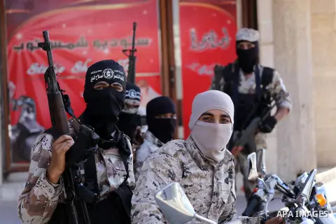Palestinian militants from the Al-Nasser Brigades, an armed wing of the Popular Resistance Committees (PRC), take part in a military parade, in Gaza city, on September 29, 2017, to mark the 17th anniversary of the creati...