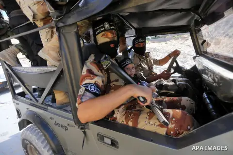 Palestinian militants from the Al-Nasser Brigades, an armed wing of the Popular Resistance Committees (PRC), take part in a military parade, in Gaza city, on September 29, 2017, to mark the 17th anniversary of the creati...