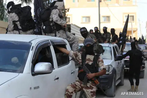 Palestinian militants from the Al-Nasser Brigades, an armed wing of the Popular Resistance Committees (PRC), take part in a military parade, in Gaza city, on September 29, 2017, to mark the 17th anniversary of the creati...