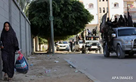 Palestinian militants from the Al-Nasser Brigades, an armed wing of the Popular Resistance Committees (PRC), take part in a military parade, in Gaza city, on September 29, 2017, to mark the 17th anniversary of the creati...