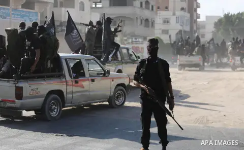 Palestinian militants from the Al-Nasser Brigades, an armed wing of the Popular Resistance Committees (PRC), take part in a military parade, in Gaza city, on September 29, 2017, to mark the 17th anniversary of the creati...