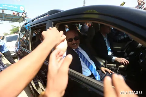 Palestinian Minister of public works and housing, Mofeed al-Hasayna arrives with Palestinian Prime Minister Rami Hamdallah and his government ministers to the Erez border crossing in the northern Gaza Strip on October 2,...