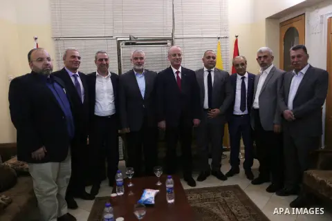 Hamas' overall leader Ismail Haniya, Palestinian prime minister Rami Hamdallah, Hamas's leader in the Gaza Strip Yahya Sinwar and Palestinian officials pose for a photo following a meeting in Gaza City October 2, 2017. P...