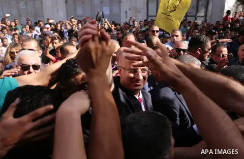 Palestinian Prime Minister Rami Hamdallah waves during his visit to the Shejaiya neighborhood in Gaza City on October 2, 2017. Palestinian prime minister Rami Hamdallah arrived in Gaza for his first visit in two years, s...