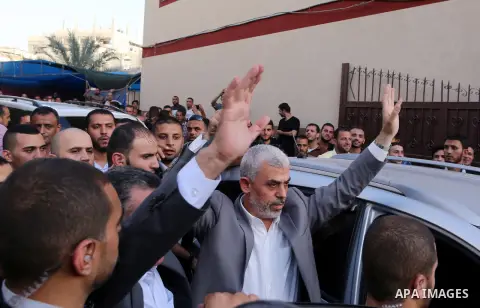 Hamas's leader in the Gaza Strip Yahya Sinwar waves as he arrives for a meeting with Palestinian prime minister and other officials in Gaza City October 2, 2017. Palestinian prime minister Rami Hamdallah arrived in Gaza...