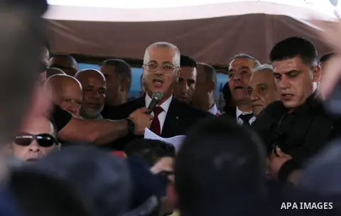 Palestinian Prime Minister Rami Hamdallah makes a statement after his arrival at the Erez border crossing in the northern Gaza Strip on October 2, 2017. Palestinian prime minister Rami Hamdallah arrived in Gaza for his f...