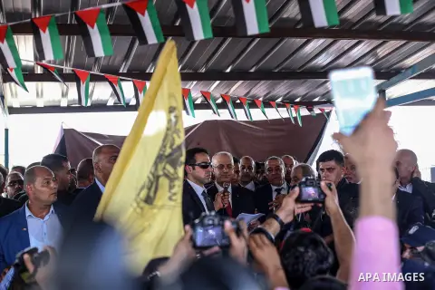Palestinian prime minister Rami Hamdallah is surrounded by security as he arrives at the Erez border crossing in the northern Gaza Strip on October 2, 2017. Palestinian prime minister Rami Hamdallah arrived in Gaza for h...
