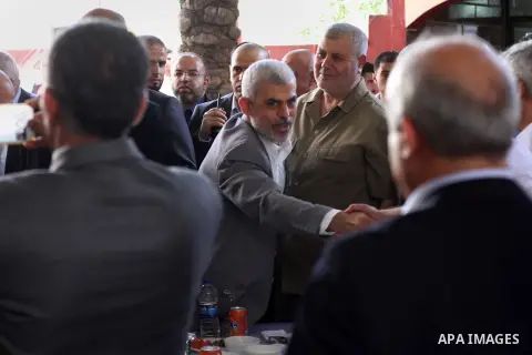 Hamas's leader in the Gaza Strip Yahya Sinwar waves as he arrives for a meeting with Palestinian prime minister and other officials in Gaza city on October 2, 2017. Palestinian prime minister Rami Hamdallah arrived in Ga...