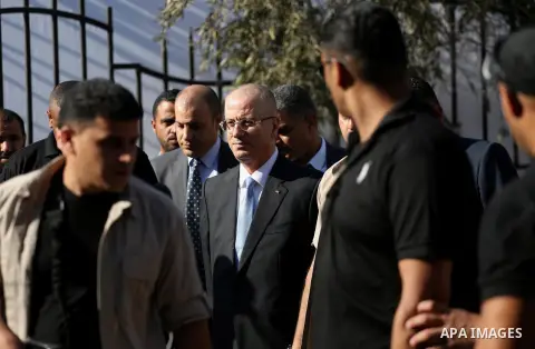 Palestinian Prime Minister Rami Hamdallah arrives before a reconciliation cabinet meeting in Gaza City on October 3, 2017. The Palestinian reconciliation government met in Gaza for the first time since 2014 as moves inte...