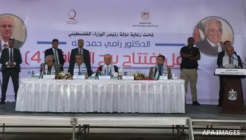 Palestinian Prime Minister Rami Hamdallah attends the opening ceremony of al-Zafer building, which was destroyed during the recent Israeli war on Gaza Strip, in Gaza city on October 3, 2017. Photo by Alaa Sarraj