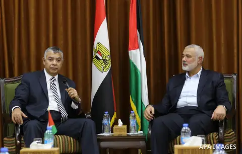 Palestinian Hamas Chief Ismail Haniyeh meets with Egyptian Intelligence Minister Khalid Fawzi at his office in Gaza City on October 3, 2017. Photo by Mohammed Asad
