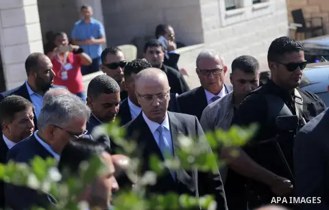 Palestinian Prime Minister Rami Hamdallah arrives to meet with Hamas Chief Ismail Haniyeh in Gaza City, October 3, 2017. Hamdallah arrived in Gaza for his first visit in two years, saying the Palestinian Authority would...