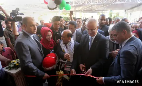Palestinian Prime Minister Rami Hamdallah attends the opening ceremony of al-Zafer building, which was destroyed during the recent Israeli war on Gaza Strip, in Gaza city on October 3, 2017. Photo by Yasser Qudih