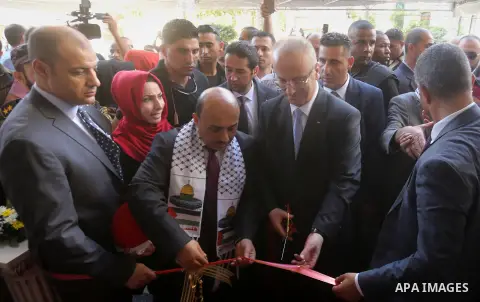 Palestinian Prime Minister Rami Hamdallah attends the opening ceremony of al-Zafer building, which was destroyed during the recent Israeli war on Gaza Strip, in Gaza city on October 3, 2017. Photo by Yasser Qudih