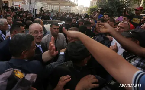 Palestinian Prime Minister Rami Hamdallah attends the opening ceremony of al-Zafer building, which was destroyed during the recent Israeli war on Gaza Strip, in Gaza city on October 3, 2017. Photo by Yasser Qudih