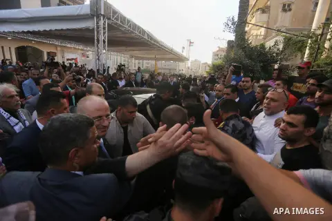 Palestinian Prime Minister Rami Hamdallah attends the opening ceremony of al-Zafer building, which was destroyed during the recent Israeli war on Gaza Strip, in Gaza city on October 3, 2017. Photo by Yasser Qudih