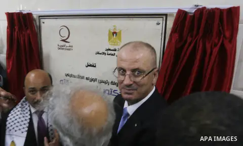 Palestinian Prime Minister Rami Hamdallah attends the opening ceremony of al-Zafer building, which was destroyed during the recent Israeli war on Gaza Strip, in Gaza city on October 3, 2017. Photo by Yasser Qudih