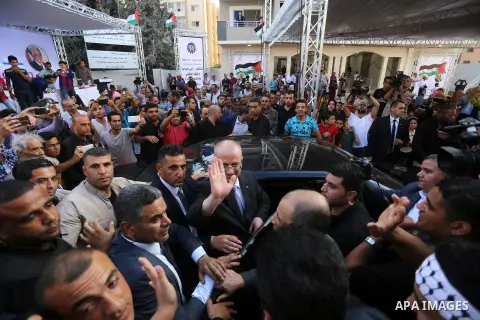 Palestinian Prime Minister Rami Hamdallah attends the opening ceremony of al-Zafer building, which was destroyed during the recent Israeli war on Gaza Strip, in Gaza city on October 3, 2017. Photo by Yasser Qudih