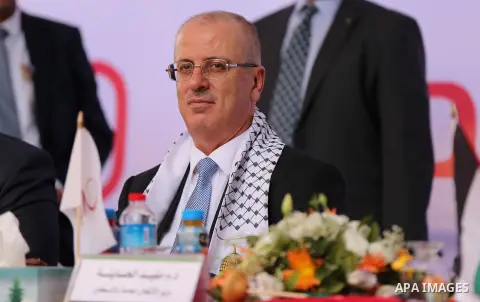 Palestinian Prime Minister Rami Hamdallah attends the opening ceremony of al-Zafer building, which was destroyed during the recent Israeli war on Gaza Strip, in Gaza city on October 3, 2017. Photo by Yasser Qudih