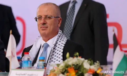 Palestinian Prime Minister Rami Hamdallah attends the opening ceremony of al-Zafer building, which was destroyed during the recent Israeli war on Gaza Strip, in Gaza city on October 3, 2017. Photo by Yasser Qudih