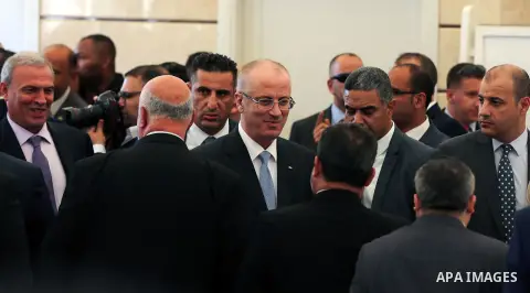 Palestinian Prime Minister Rami Hamdallah arrives before a reconciliation cabinet meeting in Gaza City on October 3, 2017. The Palestinian reconciliation government met in Gaza for the first time since 2014 as moves inte...