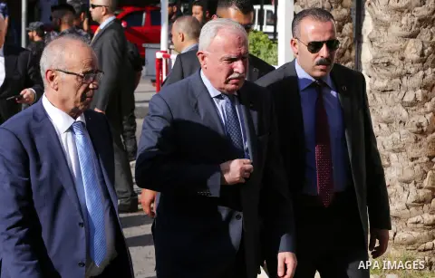 Palestinian Foreign Minister Riad al-Maliki and Palestinian Minister of Transport and Communications Samih Tabila arrive before a reconciliation cabinet meeting in Gaza City on October 3, 2017. The Palestinian reconcilia...