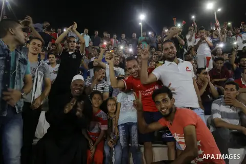 Supporters of Egypt celebrate after the 2018 FIFA World Cup qualification match between Egypt and Congo, in Cairo, Egypt, Oct. 8, 2017. Egypt won 2-1 and qualified to the World Cup finals. Photo by Stringer