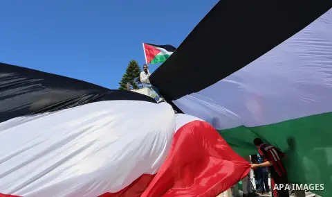 Palestinians wave the flags of Egypt, Palestine, Fatah and Hamas as they gather in Gaza City to celebrate after rival Palestinian factions Hamas and Fatah reached an agreement on ending a decade-long split following talk...