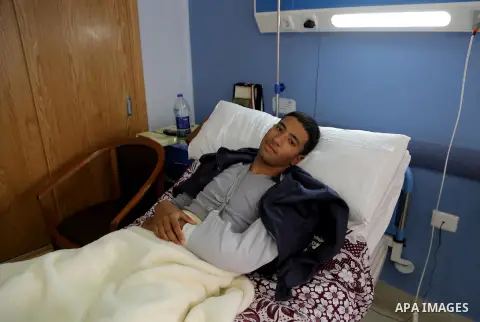 An Egyptian policeman injured during the anti-terror shootout in the desert of Giza province receives medical treatment in a police hospital in Giza, Egypt, on Oct. 26, 2017. 16 policemen were killed and another went mis...
