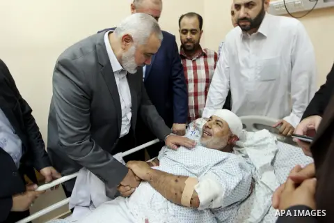 Hamas Chief Ismail Haniya visits Tawfiq Abu Naim, director general of the internal security forces, at a hospital in Gaza City. The head of Hamas security forces in the Gaza Strip was injured a day earlier when his car e...