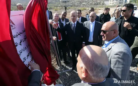 Palestinian Prime Minister, Rami Hamdallah, attends the opening of five new government schools, in the West Bank city of Nablus, on October 29, 2017. Photo by Prime Minister Office