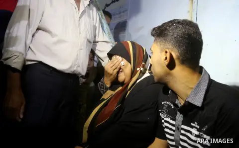 A Palestinian woman reacts after her relative was killed after Israel blew up what it said was a tunnel stretching from the Gaza Strip into its territory, at a morgue at al-Aqsa hospital in Deir el-Balah, in central Gaza...