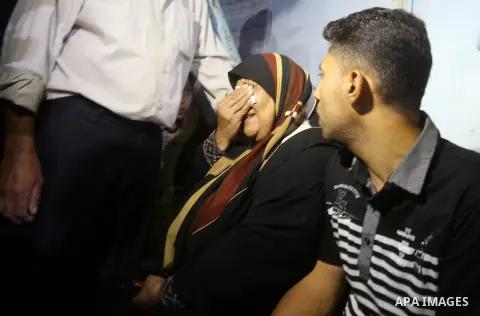A Palestinian woman reacts after her relative was killed after Israel blew up what it said was a tunnel stretching from the Gaza Strip into its territory, at a morgue at al-Aqsa hospital in Deir el-Balah, in central Gaza...