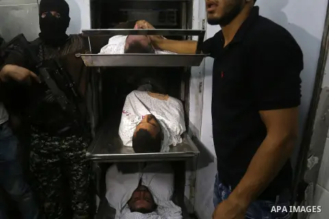 The bodies of Palestinians killed after Israel blew up what it said was a tunnel stretching from the Gaza Strip into its territory, lie at a morgue at al-Aqsa hospital in Deir el-Balah, in central Gaza, on October 30, 20...
