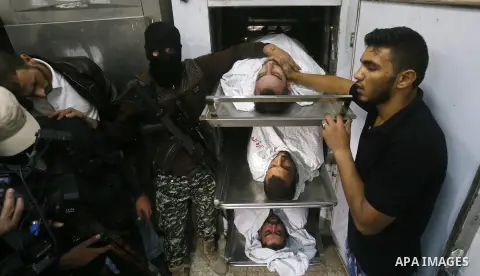The bodies of Palestinians killed after Israel blew up what it said was a tunnel stretching from the Gaza Strip into its territory, lie at a morgue at al-Aqsa hospital in Deir el-Balah, in central Gaza, on October 30, 20...