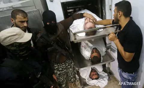 The bodies of Palestinians killed after Israel blew up what it said was a tunnel stretching from the Gaza Strip into its territory, lie at a morgue at al-Aqsa hospital in Deir el-Balah, in central Gaza, on October 30, 20...