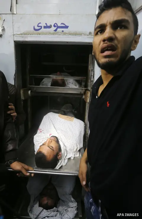 The bodies of Palestinians killed after Israel blew up what it said was a tunnel stretching from the Gaza Strip into its territory, lie at a morgue at al-Aqsa hospital in Deir el-Balah, in central Gaza, on October 30, 20...