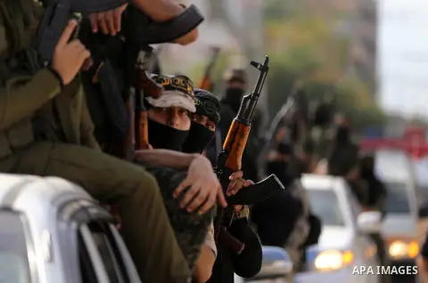 Palestinian Islamic Jihad militants attend the funeral of comrades killed in an Israeli operation to blow up a tunnel stretching from the Gaza Strip into Israel at the Bureij refugee camp, in central Gaza, on October 31,...