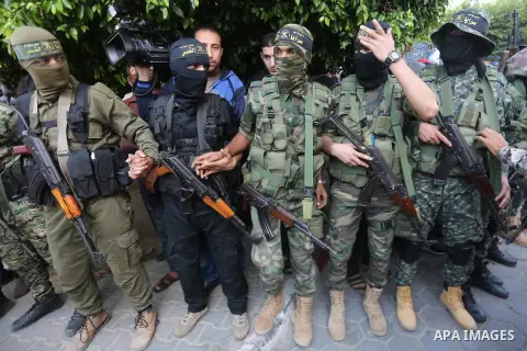 Palestinian Islamic Jihad militants attend the funeral of one of the Palestinians killed in an Israeli operation to blow up a tunnel stretching from the Gaza Strip into Israel in Bureij refugee camp in central Gaza Strip...