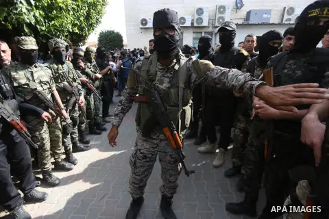 Palestinian Islamic Jihad militants attend the funeral of one of the Palestinians killed in an Israeli operation to blow up a tunnel stretching from the Gaza Strip into Israel in Bureij refugee camp in central Gaza Strip...